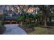 Beautiful two-story home with a brick exterior, manicured landscaping, and a two-car garage at 15 Watroo Pt, Daniel Island, SC 29492