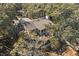 Aerial view of property highlighting the deck and natural surroundings among lush trees at 161 Marsh Hawk Ln, Kiawah Island, SC 29455