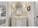 Bathroom vanity with decorative mirror, sconces, and stylish fixtures at 161 Marsh Hawk Ln, Kiawah Island, SC 29455