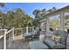 Cozy deck space with comfortable seating, perfect for enjoying the serene outdoor environment at 161 Marsh Hawk Ln, Kiawah Island, SC 29455