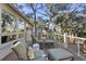 Relaxing deck area featuring comfortable seating and views of surrounding landscape at 161 Marsh Hawk Ln, Kiawah Island, SC 29455