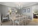 Dining room featuring decorative lighting, light gray walls, and a carpeted floor at 161 Marsh Hawk Ln, Kiawah Island, SC 29455