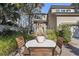 Inviting home with a quaint patio, manicured landscaping, and a charming exterior at 161 Marsh Hawk Ln, Kiawah Island, SC 29455