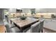 Spacious kitchen with granite island, stainless steel appliances, and ample cabinet space at 161 Marsh Hawk Ln, Kiawah Island, SC 29455