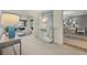 Open living room showcasing a console table, decorative shelving, and a glimpse into the dining area at 161 Marsh Hawk Ln, Kiawah Island, SC 29455