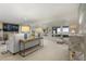 Bright and airy living room featuring neutral decor and large windows with scenic views at 161 Marsh Hawk Ln, Kiawah Island, SC 29455