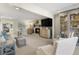 Cozy living room featuring a fireplace, comfortable seating, and stylish decor, creating a warm ambiance at 161 Marsh Hawk Ln, Kiawah Island, SC 29455