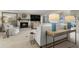 Well-lit living room featuring a fireplace, comfortable seating, and stylish decor, creating a relaxing atmosphere at 161 Marsh Hawk Ln, Kiawah Island, SC 29455
