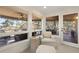 Relaxing screened porch with comfortable seating and scenic outdoor views for enjoying the natural surroundings at 161 Marsh Hawk Ln, Kiawah Island, SC 29455