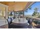 Spacious screened porch with water views, wood ceiling, and dining table at 161 Marsh Hawk Ln, Kiawah Island, SC 29455