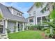 Scenic backyard featuring lush landscaping, a well-manicured lawn, and a light gray home exterior at 164 River Green Pl, Charleston, SC 29492