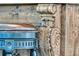 Close-up of the bar showcasing its intricate wood carvings, stylish stool, and elegant details, highlighting craftsmanship and design at 164 River Green Pl, Charleston, SC 29492