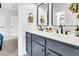 Modern bathroom boasts a double vanity with bronze fixtures and stylish decorative elements at 164 River Green Pl, Charleston, SC 29492