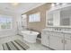 The bathroom features a standalone tub, marble floors, and a decorative wall at 164 River Green Pl, Charleston, SC 29492