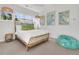 Bright bedroom featuring a unique wicker bed frame, tropical pillows, and natural lighting at 164 River Green Pl, Charleston, SC 29492