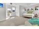 Bright and airy bedroom with a wicker bed, lots of light, and a beachy beanbag chair at 164 River Green Pl, Charleston, SC 29492