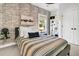 Inviting bedroom features decorative wallpaper, a comfortable bed, and ample natural light at 164 River Green Pl, Charleston, SC 29492
