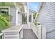 Outdoor deck, with palm tree views, offers a perfect spot for relaxation and enjoying the serene setting at 164 River Green Pl, Charleston, SC 29492