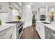 Beautiful kitchen features white cabinets, stainless appliances, and a subway tile backsplash at 164 River Green Pl, Charleston, SC 29492