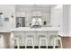 Spacious kitchen island with seating, stainless steel appliances, and modern white cabinetry at 164 River Green Pl, Charleston, SC 29492