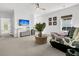Light and bright living area with a large sofa, ceiling fan, and a table with seating at 164 River Green Pl, Charleston, SC 29492