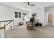 Upstairs loft living area with a ceiling fan, plush sofa, and a table with seating at 164 River Green Pl, Charleston, SC 29492