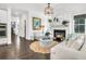 Open-concept living space featuring a fireplace, modern decor, and seamless flow between rooms at 164 River Green Pl, Charleston, SC 29492