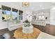 Bright and airy living room with a modern coastal feel, showcasing open layout to kitchen and natural light at 164 River Green Pl, Charleston, SC 29492
