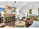 Bright living room with a bar, rattan table, and armchairs, blending style and comfort for a welcoming atmosphere at 164 River Green Pl, Charleston, SC 29492