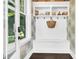 Charming mudroom boasts built-in storage and bench, creating a functional and welcoming space at 164 River Green Pl, Charleston, SC 29492