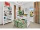 A well lit home office features a bookshelf, desk, and chair at 164 River Green Pl, Charleston, SC 29492