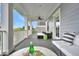 This porch has a seating area and a beautiful outdoor view at 164 River Green Pl, Charleston, SC 29492