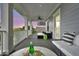 An outdoor porch has multiple seating arrangements and a beautiful view at 164 River Green Pl, Charleston, SC 29492