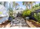 Cozy backyard featuring a stone walkway leading to an outdoor dining area at 179 Wentworth St, Charleston, SC 29401