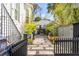 Backyard featuring a stone walkway, potted plants and a barbecue grill at 179 Wentworth St, Charleston, SC 29401