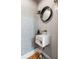 Stylish powder room features a modern sink, round mirror, and unique patterned wallpaper at 179 Wentworth St, Charleston, SC 29401