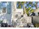 Outdoor deck with a staircase, BBQ, and charming garden at 179 Wentworth St, Charleston, SC 29401