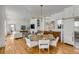 Bright open concept living and dining area with hardwood floors and modern lighting at 179 Wentworth St, Charleston, SC 29401