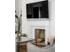 Cozy living room fireplace featuring decorative accents and a modern aesthetic at 179 Wentworth St, Charleston, SC 29401