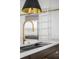 Bright kitchen showcases stainless steel refrigerator, white ladder, and black and gold light fixture at 179 Wentworth St, Charleston, SC 29401