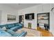Spacious living room with built-in desks, fireplace, comfortable seating, and natural light at 179 Wentworth St, Charleston, SC 29401
