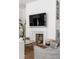 Cozy living room with fireplace, modern furniture, and natural light at 179 Wentworth St, Charleston, SC 29401