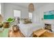 Bright, airy main bedroom with hardwood floors, a decorative fireplace, and stylish furnishings at 179 Wentworth St, Charleston, SC 29401