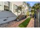 Charming home featuring a landscaped side yard with brick walkway and privacy fence at 179 Wentworth St, Charleston, SC 29401