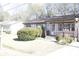 Charming brick home featuring an inviting front yard with mature landscaping at 1927 Hazelwood Dr, Charleston, SC 29407