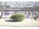 Cozy brick home with manicured front lawn and mature shrubbery at 1927 Hazelwood Dr, Charleston, SC 29407