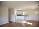 Open concept kitchen with white cabinets and seamless breakfast bar at 1927 Hazelwood Dr, Charleston, SC 29407