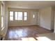 Sun-drenched living room featuring beautiful hardwood floors and ample windows at 1927 Hazelwood Dr, Charleston, SC 29407