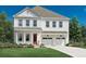 Charming two-story home with white siding, a red front door, and a two-car garage at 2004 Sea Water Dr, Charleston, SC 29412