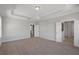 Spacious bedroom with neutral walls and carpet, offering multiple entryways to adjoining rooms at 2006 Riverbend Dr, Charleston, SC 29412